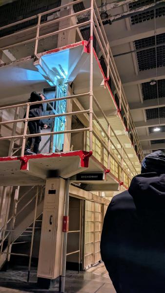 National park ranger demonstrating how the cell doors operate.